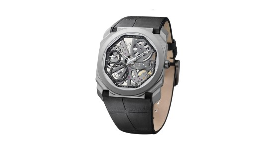 a silver skeleton dial watch by Bvlgari with a black strap