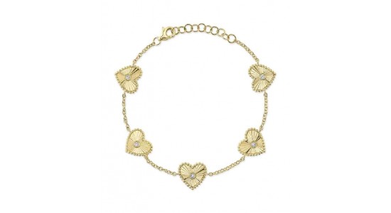 a yellow gold bracelet featuring five heart motifs with diamond accents