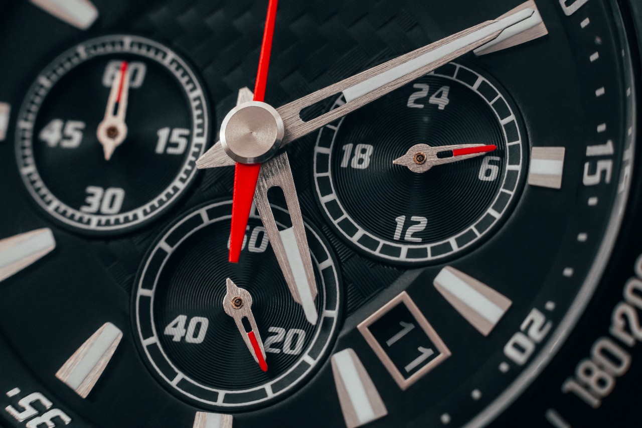 a close up image of a watch face with complications