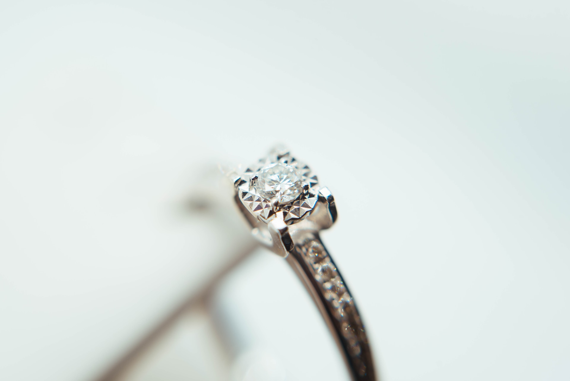 a white gold engagement ring with side stones